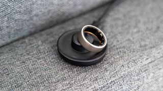 The Amazfit Helio Ring on the charger