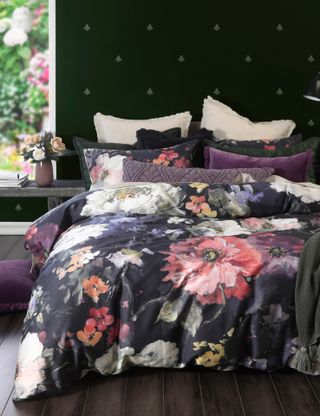 dark floral bedding in moody, feminine bedroom scheme.