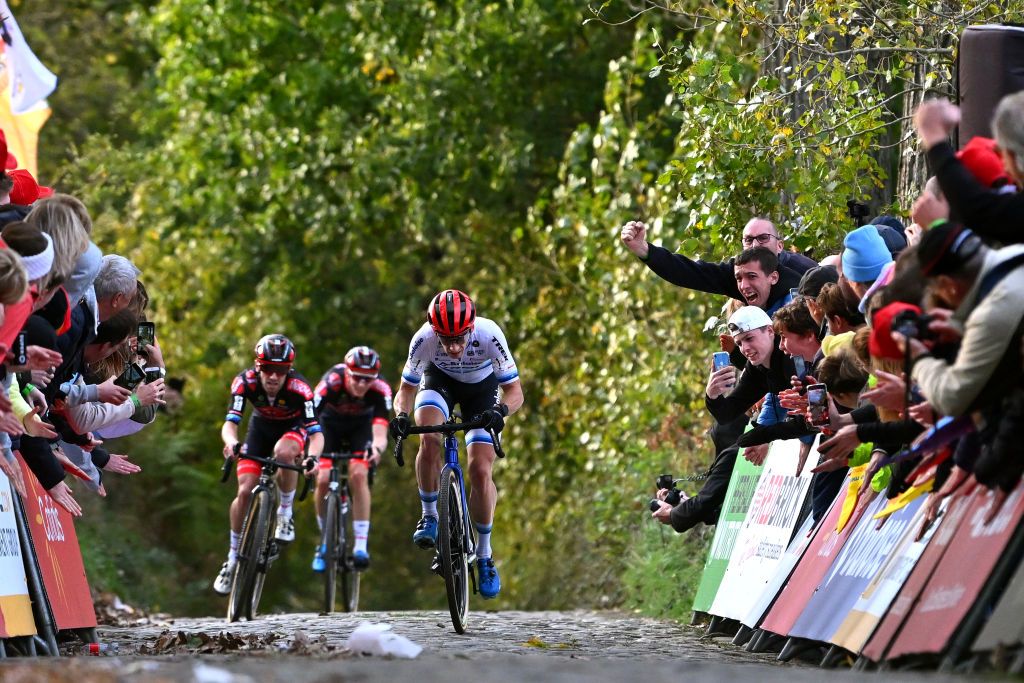 MAARKEDAL BELGIUM NOVEMBER 01 Lars Van Der Haar of The Netherlands and Team Baloise Trek Lions sprint at finish line to win ahead of Eli Iserbyt of Belgium and Team Pauwels Sauzen Bingoal and Michael Vanthourenhout of Belgium and Team Pauwels Sauzen Bingoal during the 33rd Trofee Oudenaarde Koppenbergcross 2022 Mens Elite on November 01 2022 in Maarkedal Belgium Photo by Luc ClaessenGetty Images