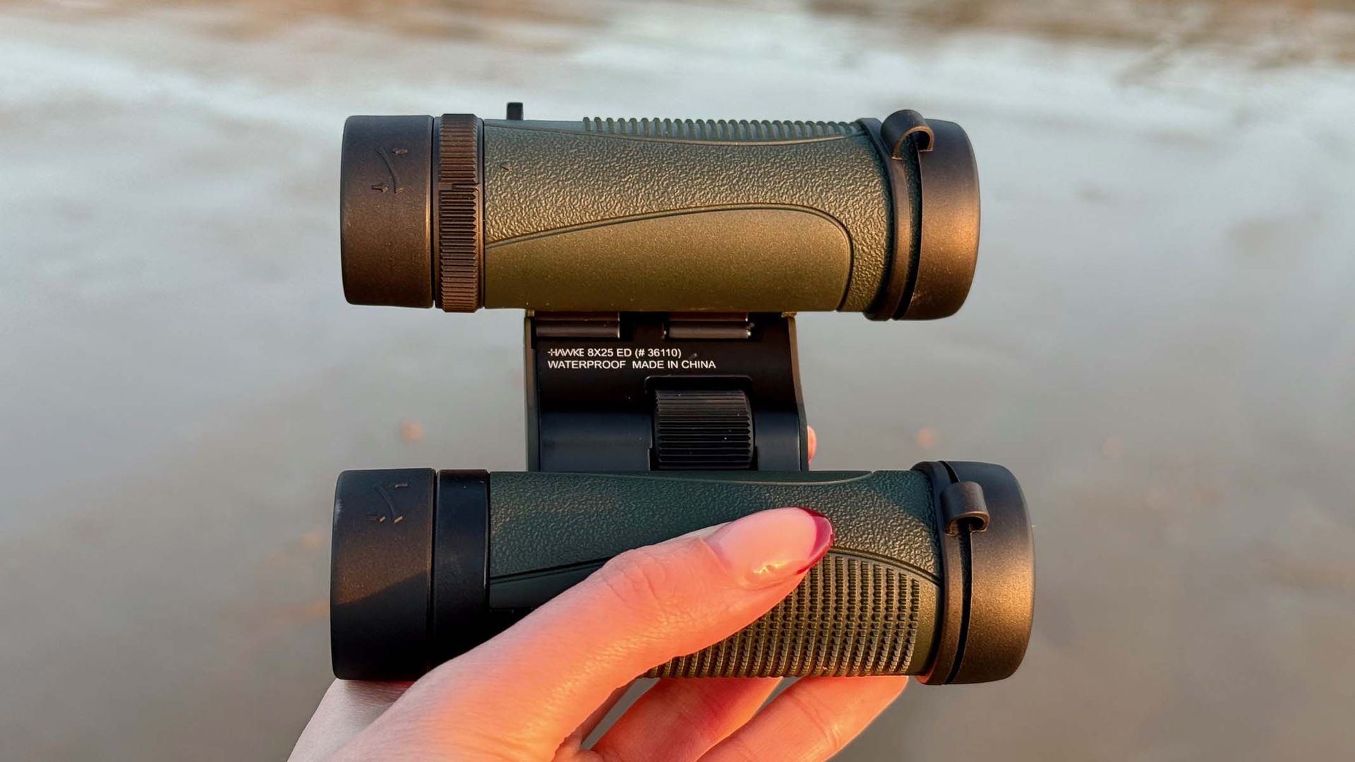 Hawke Endurance ED 8x25 in the hand at a coastal location