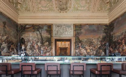 One of the restaurants in the Palacio Chiado. Bar style area goes from wall to wall, with brown leather bar chairs. Beautiful, elaborate frescoes grace the walls and ceilings.