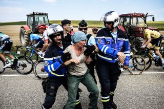 Protesters removed after disrupting the Tour de France in 2018