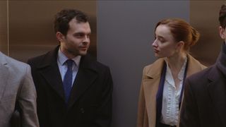 Luke (Alden Ehrenreich) and Emily (Phoebe Dynevor) in an elevator in Fair Play