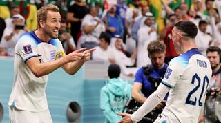 England's Harry Kane and Phil Foden celebrate against Senegal