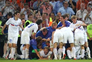 Russia players celebrate after beating the Netherlands on penalties at Euro 2008.