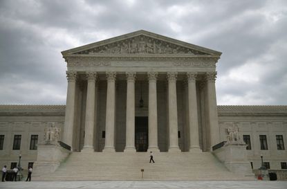 http://www.gettyimages.com/detail/news-photo/guards-stand-in-front-of-the-supreme-court-building-august-news-photo/453873568