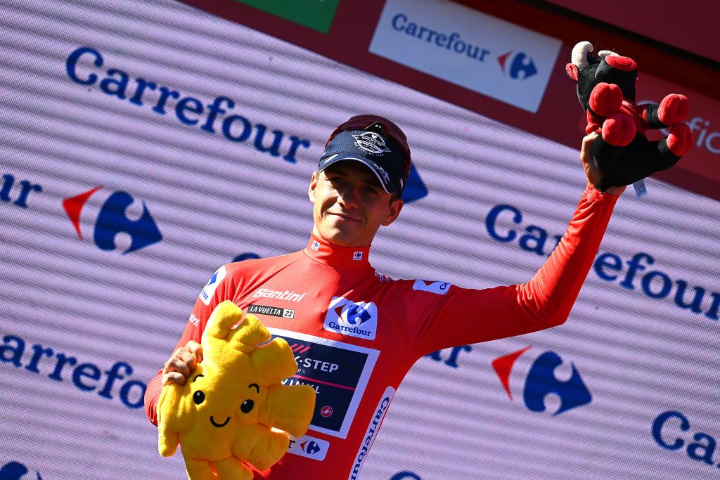TALAVERA DE LA REINA SPAIN SEPTEMBER 09 Remco Evenepoel of Belgium and Team QuickStep Alpha Vinyl Red Leader Jersey celebrates at podium during the 77th Tour of Spain 2022 Stage 19 a 1383km stage from Talavera de la Reina to Talavera de la Reina LaVuelta22 WorldTour on September 09 2022 in Talavera de la Reina Spain Photo by Tim de WaeleGetty Images