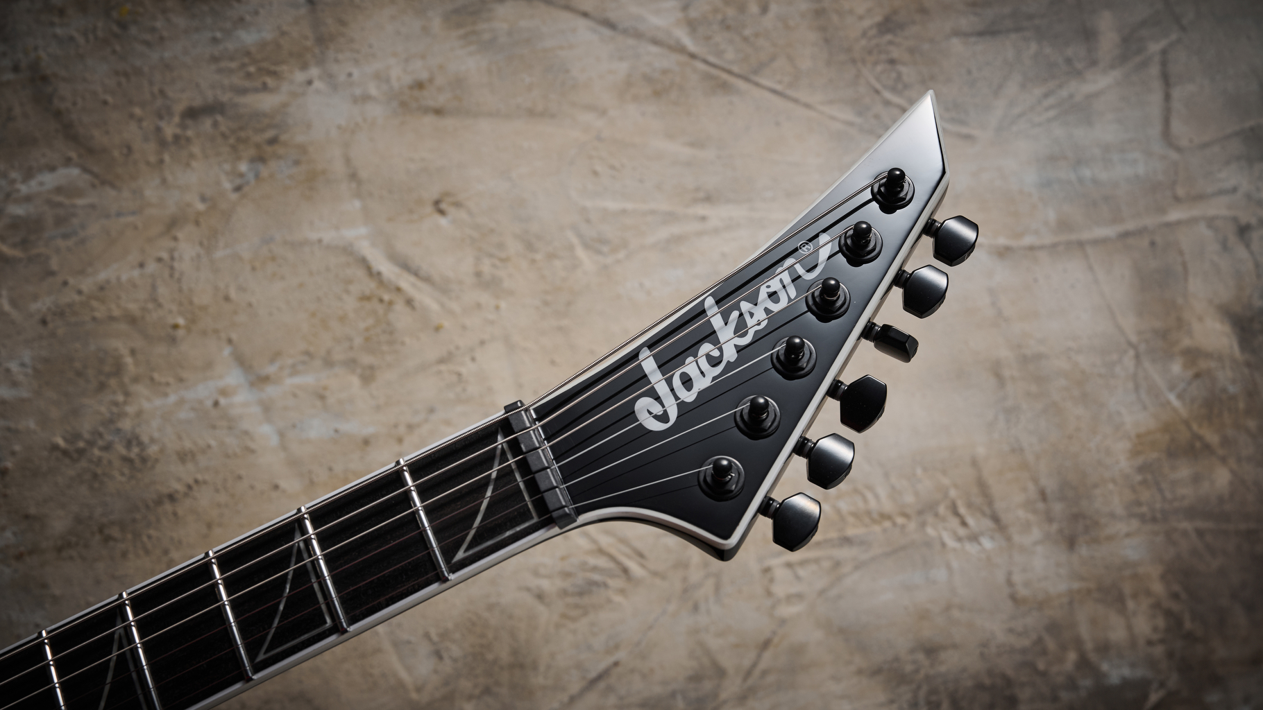 The reverse headstock on the Jackson Pro Plus Series Signature Christian Andreu Rhoads RR24 EVTN6 electric guitar