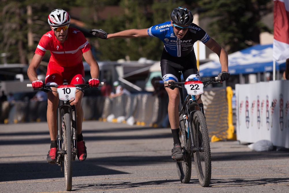 In the sportsman move of the day, and heartbreak of the day: Stephan Davoust reaches out to fellow Durango resident Todd Wells while passing him on last lap after Wells flatted while in the the lead of the short track championship event.