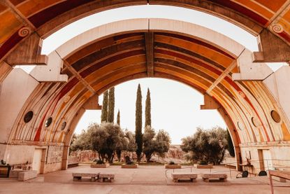 Under an arch looking out at Arcosanti