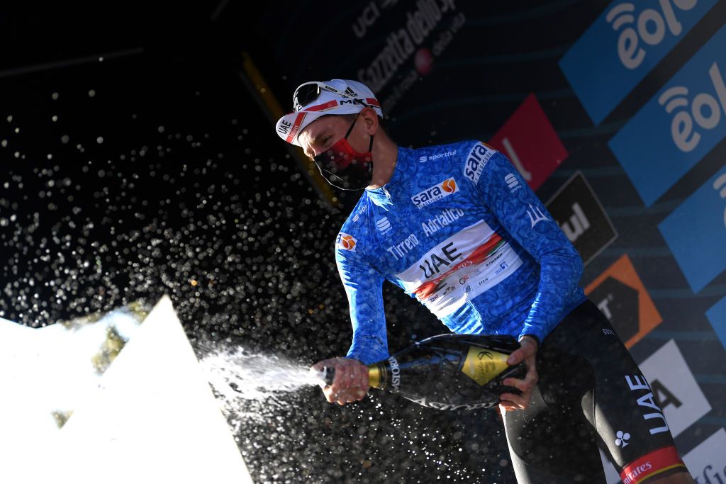 PRATI DI TIVO ITALY MARCH 13 Podium Tadej Pogacar of Slovenia and UAE Team Emirates Blue Leader Jersey Celebration during the 56th TirrenoAdriatico 2021 Stage 4 a 148km stage from Terni to Prati di Tivo 1450m Champagne Mask Covid Safety Measures TirrenoAdriatico on March 13 2021 in Prati di Tivo Italy Photo by Tim de WaeleGetty Images