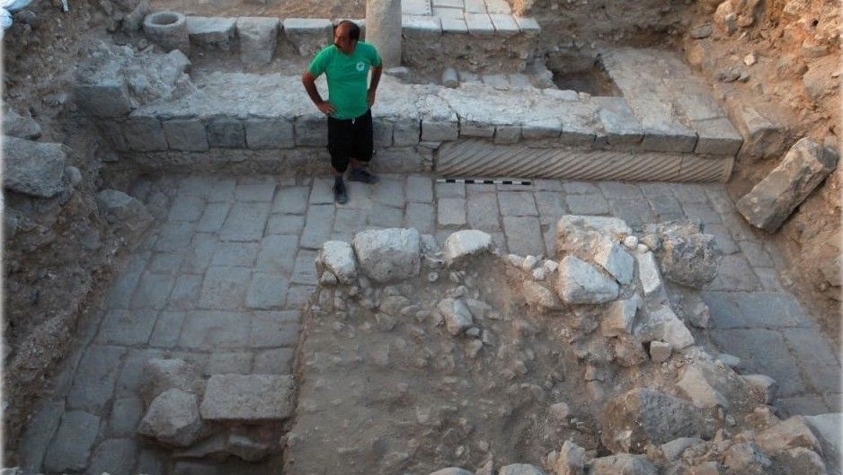 The northwest corner of the eighth century mosque, with a column in secondary use as "cornerstone."
