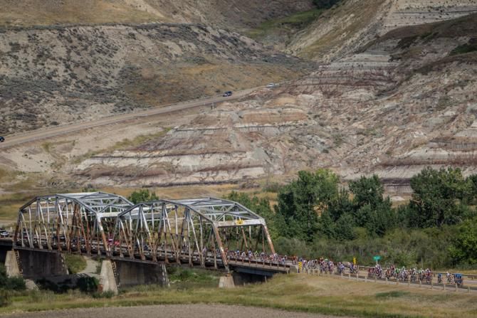 The peloton passes over a bridge on the way to the Badlands.