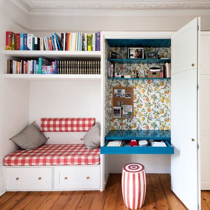 bespoke storage with cupboard and hidden desk and bench seat with cushion