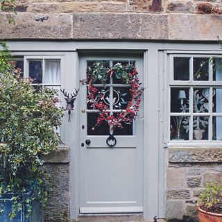 Front door with real Christmas wreath