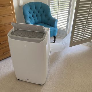 The GoodHome Malay 9000BTU air conditioner in use in a carpeted interior