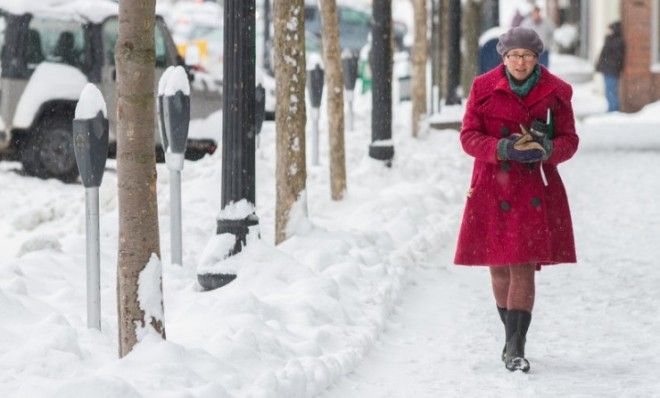 A pedestrian walks down Main St. in Greenfield, Mass., on Dec. 27 when an earlier storm hit the region before this weekend&amp;#039;s snowfall. 