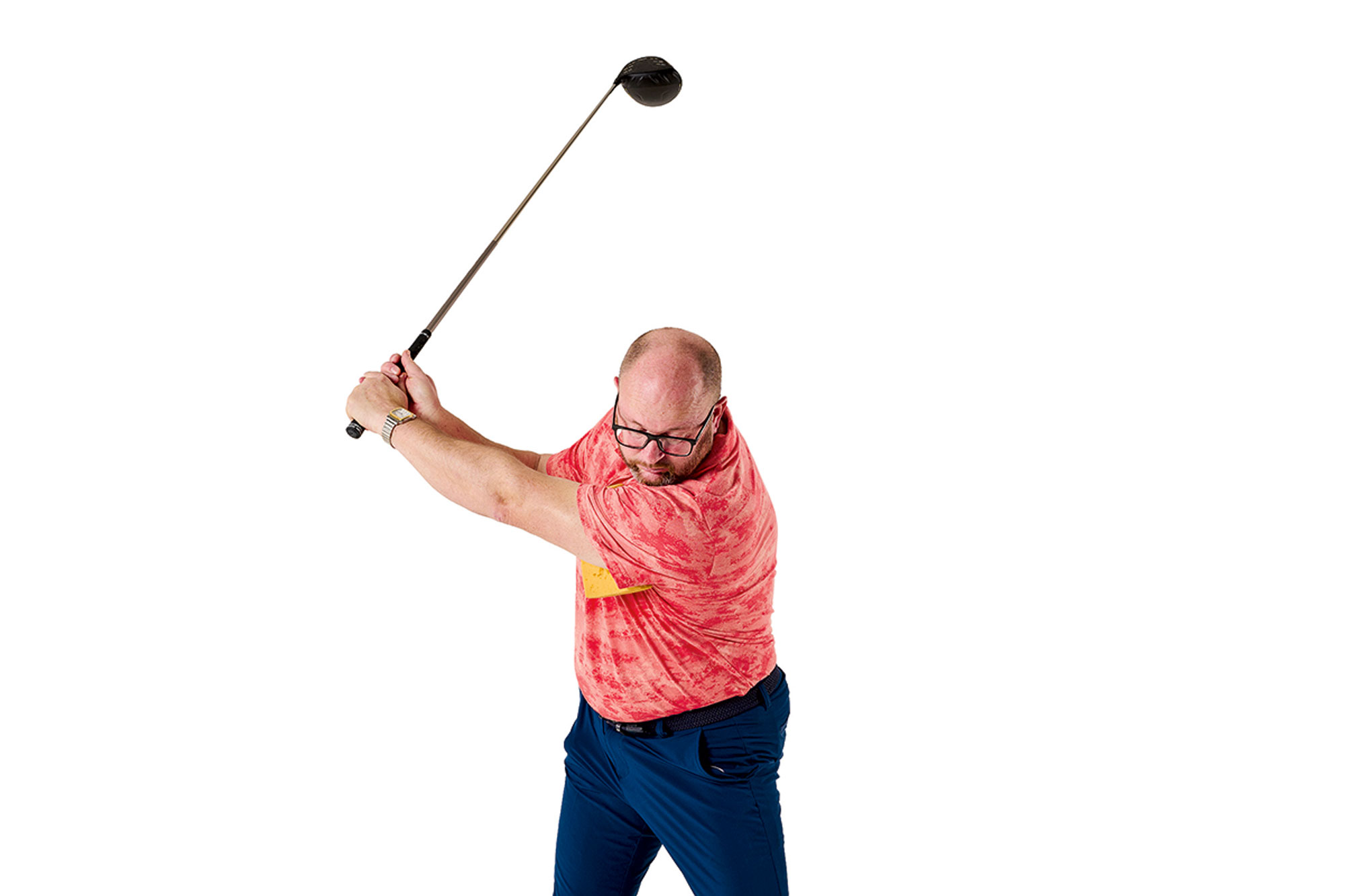 Russell Covey with the sponge still lodged under his lead arm at the top of the backswing, demonstrating the correct connection needed in the golf swing