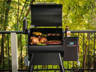 Traeger Pro 575 grill cooking steak and vegetables