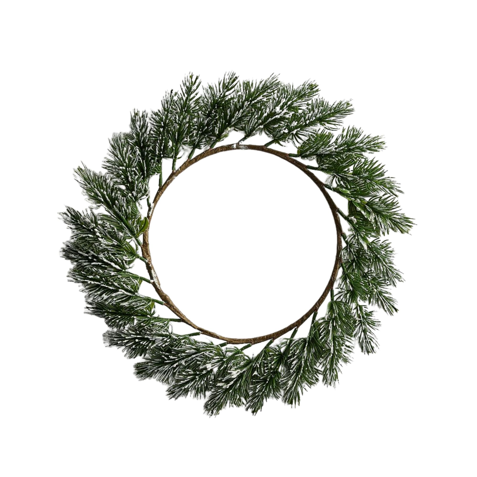 A Christmas charger plate with frosted pine leaves around it