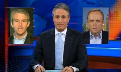Jon Stewart referees the ongoing cable news fight between CNN's Nic Robertson (left) and Fox News' Steve Harrigan.