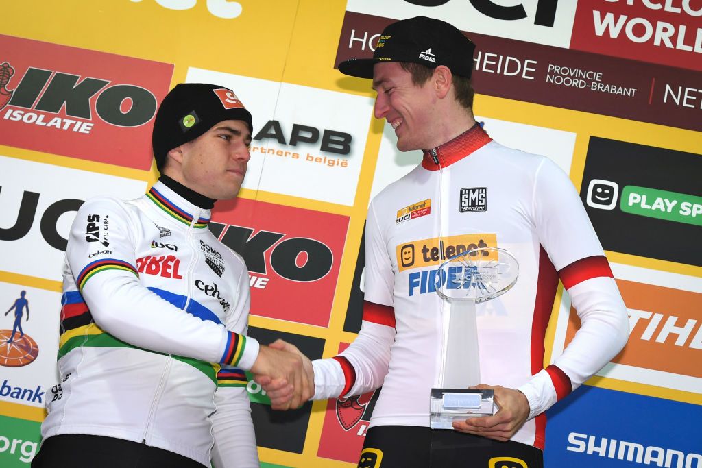Toon Aerts and Wout van Aert shake hands on the podium