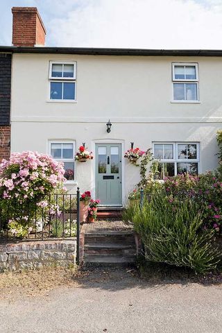 traditional cottage planting adds charm to country home