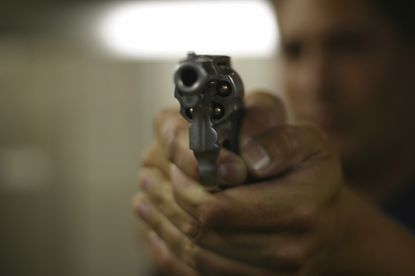 A man aims a revolver