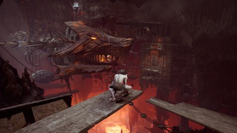 Gollum perching on a plank over the workings of Mordor's workshops in The Lord of the Rings: Gollum.