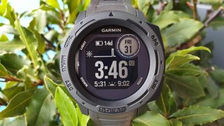 Close-up of Garmin Instinct Solar's face, showing time and date