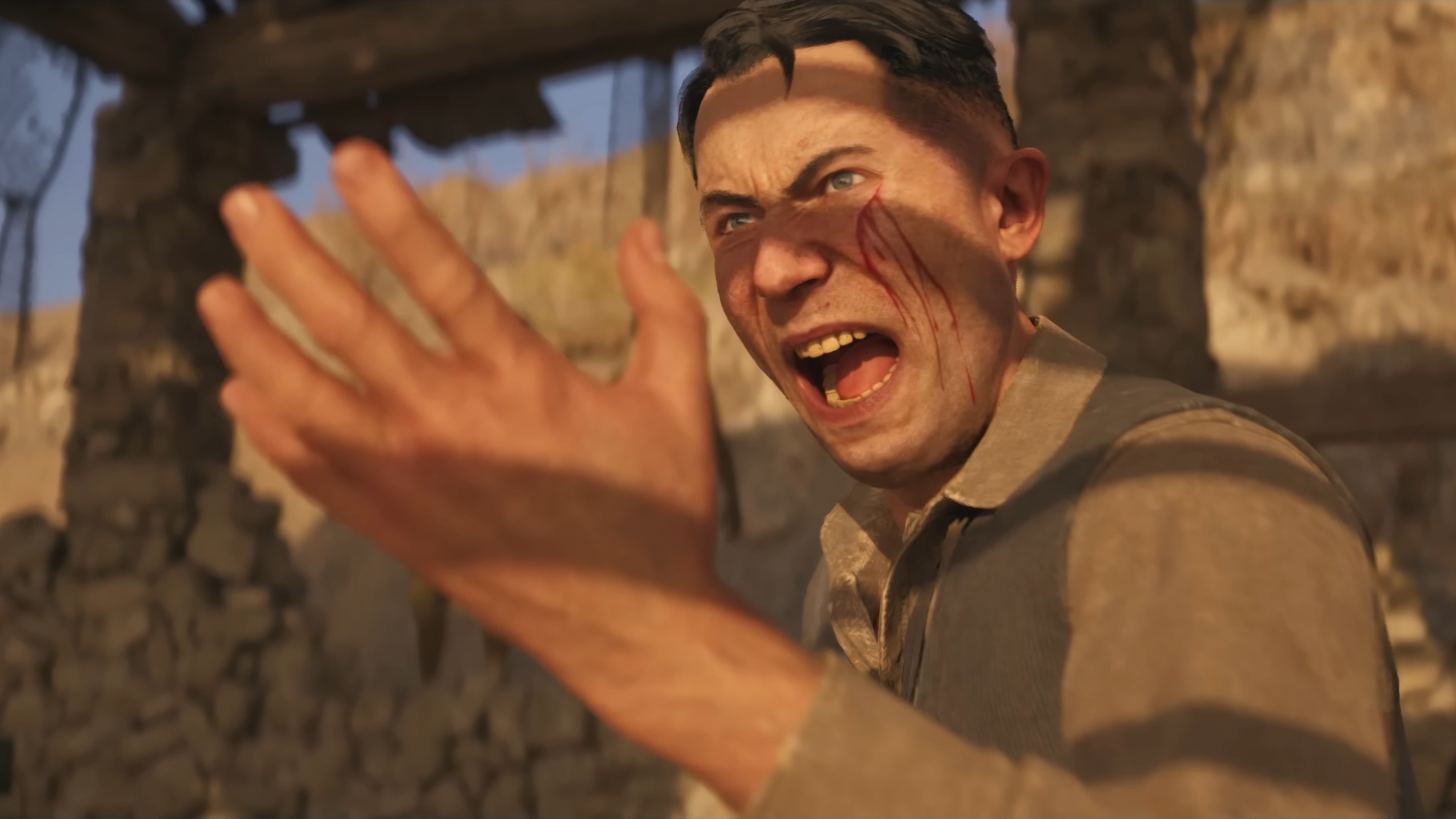 Man with facial wound screams.
