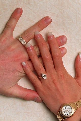 David Beckham and Victoria Beckham's hands, with their first engagement rings in January 25, 1998 in Chester, United Kingdom.