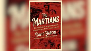 A photo of a book with a red cover that says "The Martians" in tan script