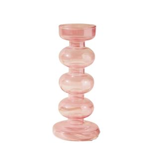 A wiggly pink candlestick holder