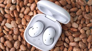 Samsung Galaxy Buds Live on top of beans