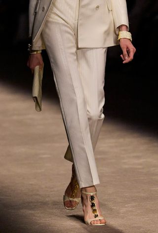 Hardware sandal trend worn by a model on the Tom Ford spring/summer 2024 runway.