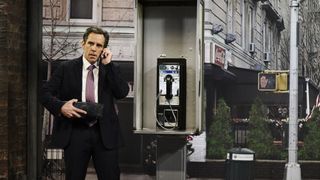Payphone, Standing, Telephone booth, Telephone, Suit, Technology, White-collar worker, Street, Telephony, City,