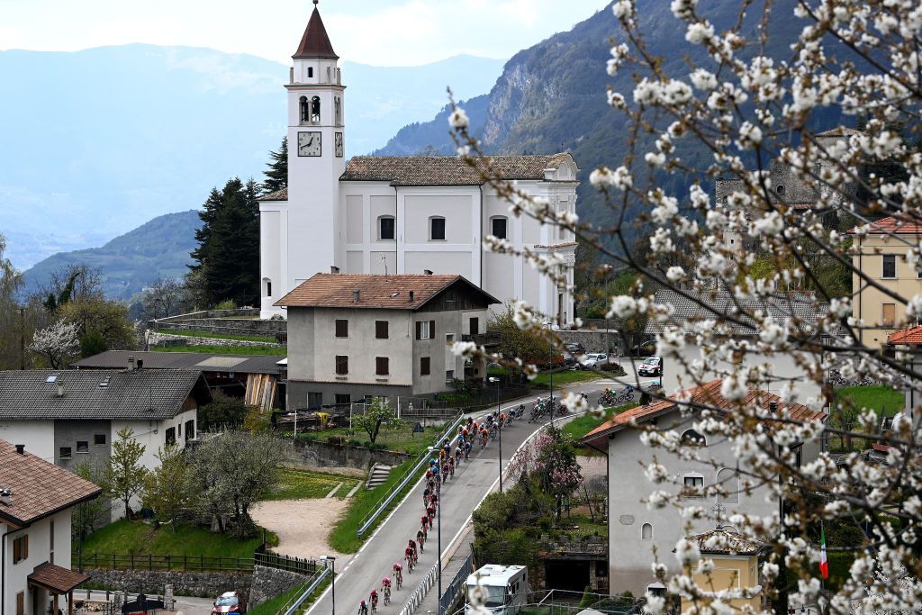 BRENTONICO SAN VALENTINO ITALY APRIL 19 A general view of the peloton passing through a Castellano village during the 46th Tour of the Alps 2023 Stage 3 a 1625km stage from Ritten to Brentonico San Valentino 1321m on April 19 2023 in Brentonico San Valentino Italy Photo by Tim de WaeleGetty Images