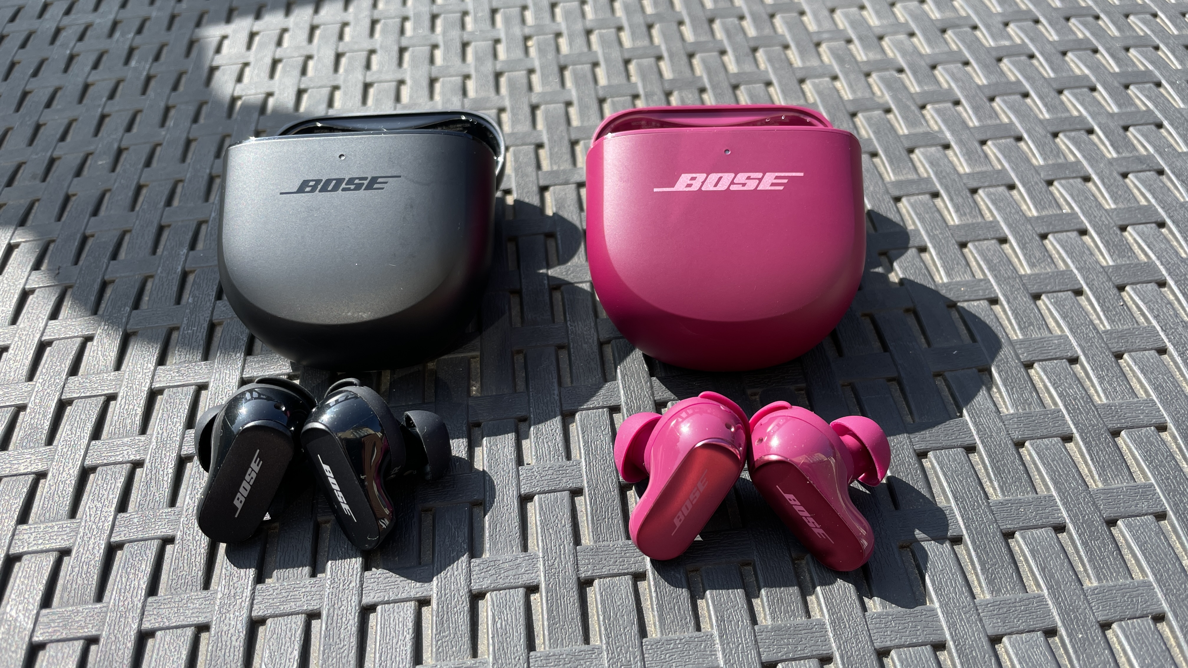 The QCUE and QCUE 2 next to each other, outside on a sunny day, showing their similarities 