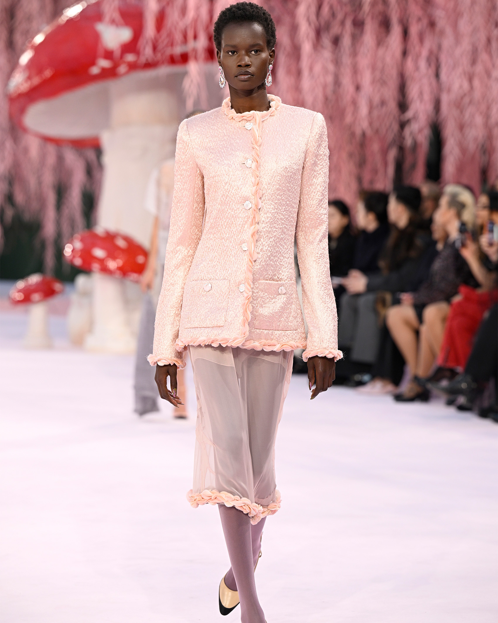 Chanel model walking down runway