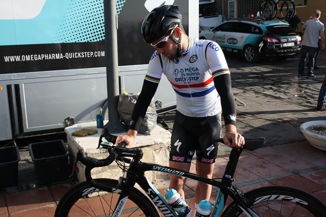 British champion Mark Cavendish inspects his ride