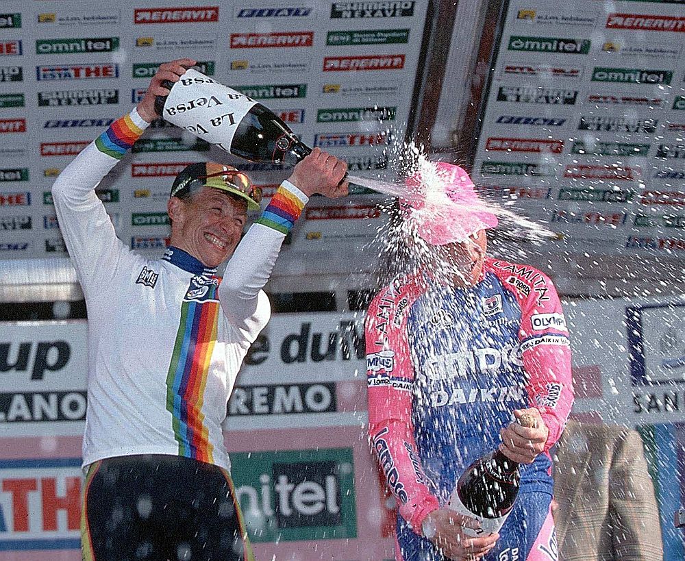 Erik Zabel soaks Zbigniew Spruch on the podium of the 1999 Milan-San Remo