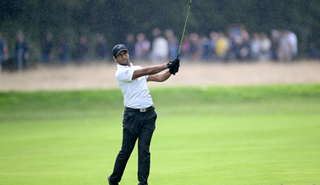 Aaron Rai strikes an iron from the fairway