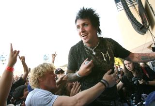 Jacoby Shaddix interacting with the crowd at a Papa Roach gig