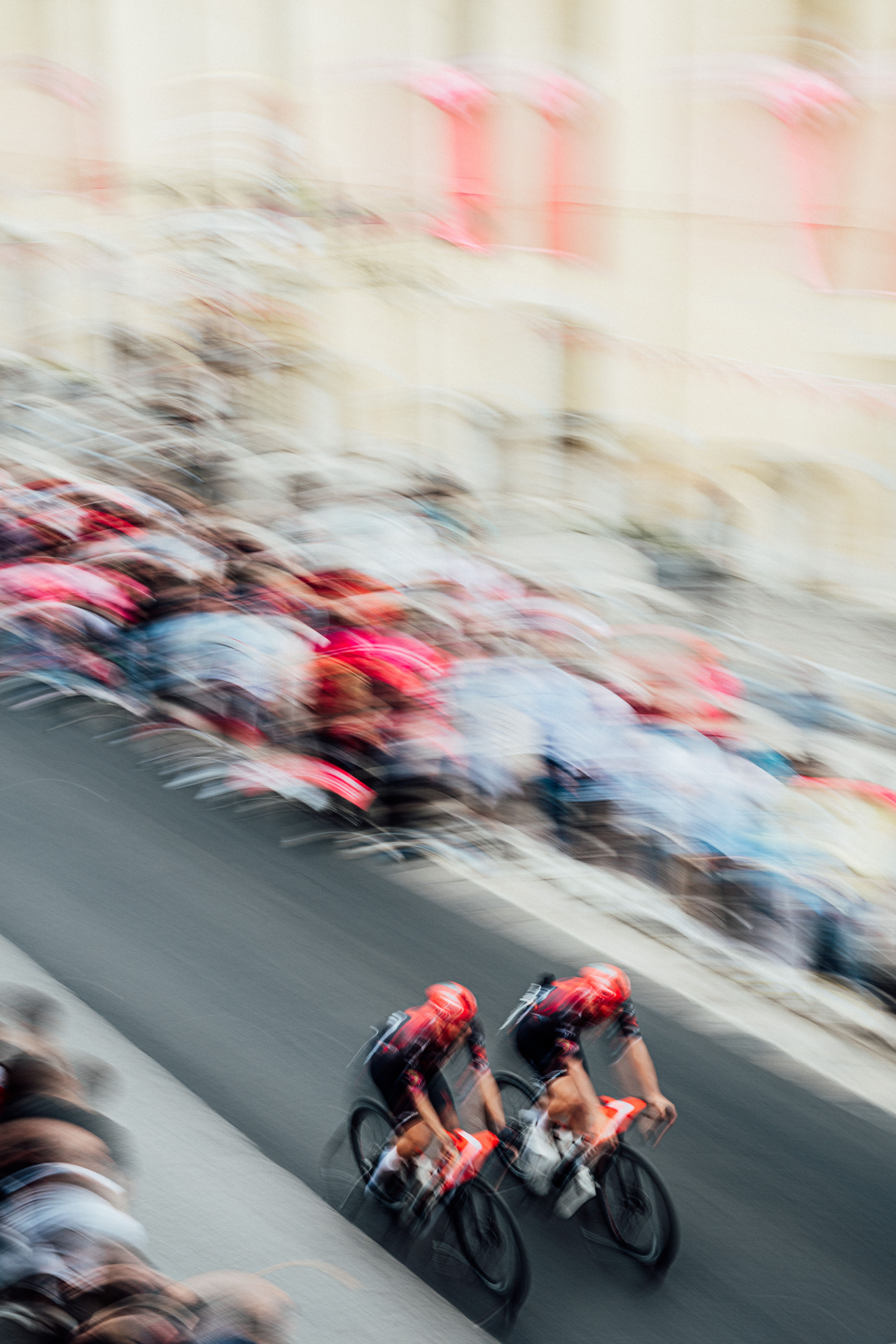 Tow Tudor cyclists riding to the start line. Images from 2026 Giro d'Italia stage 7 to Blockhaus