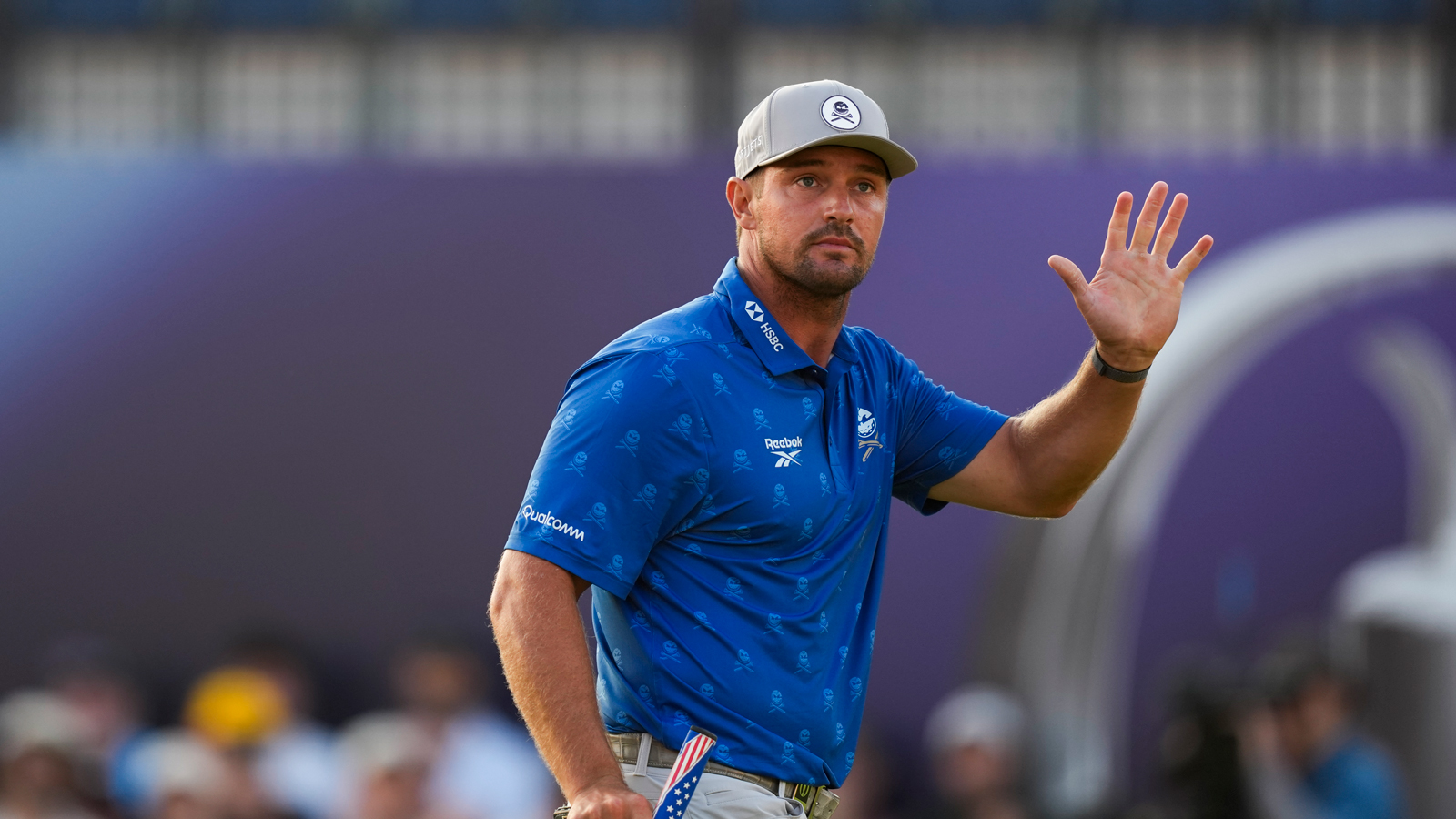 Bryson DeChambeau waves to the crowd