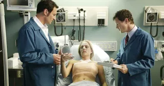 two doctors check on a woman getting breast implants at the hospital in the tv show nip/tuck