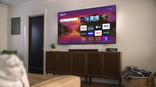 Roku Plus Series TV mounted on wall