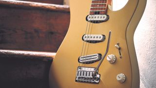 Close up of the body and pickups of a Charvel Pro-Mod DK22 in Pharaohs Gold