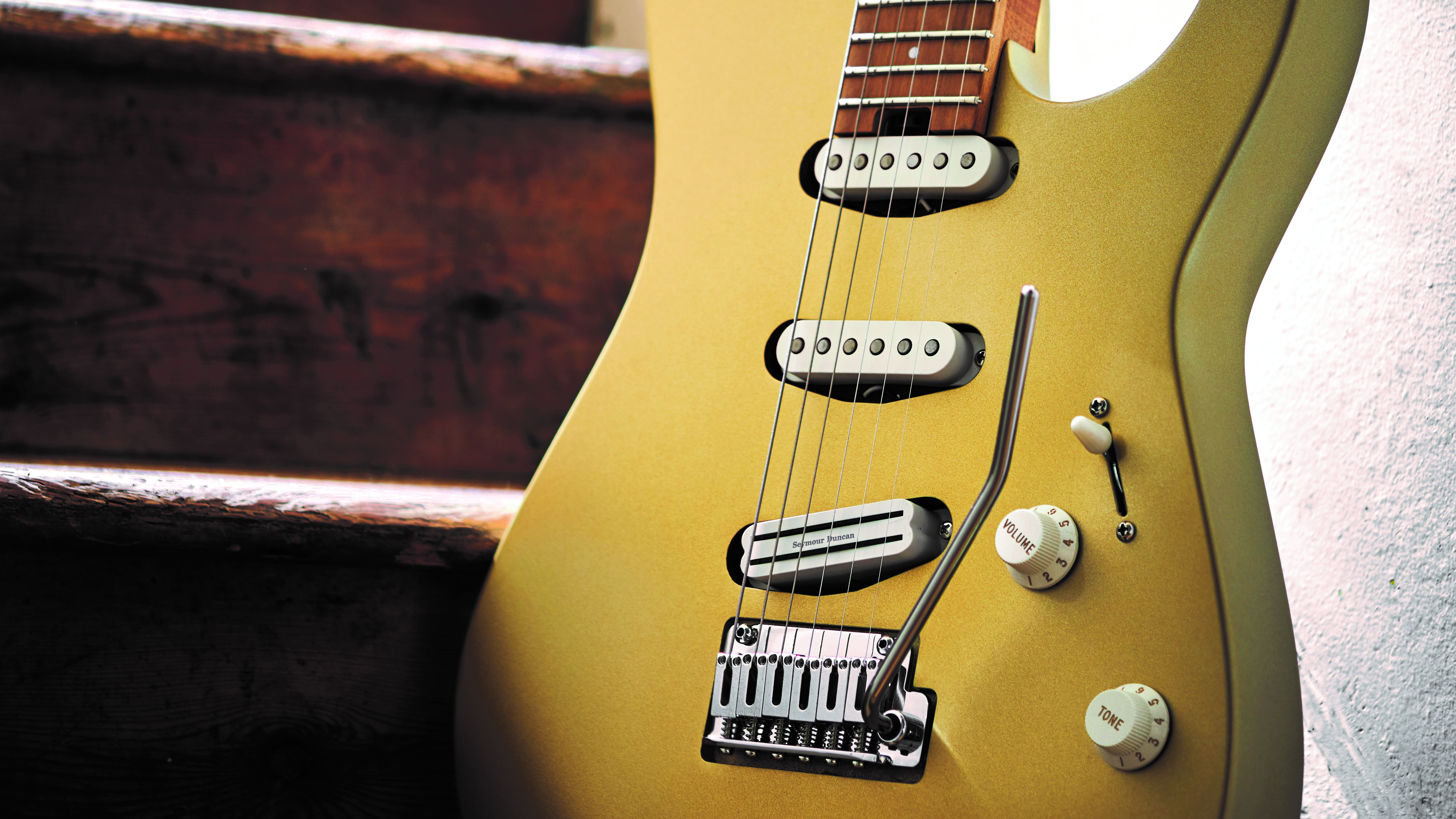 Close up of the body and pickups of a Charvel Pro-Mod DK22 in Pharaohs Gold